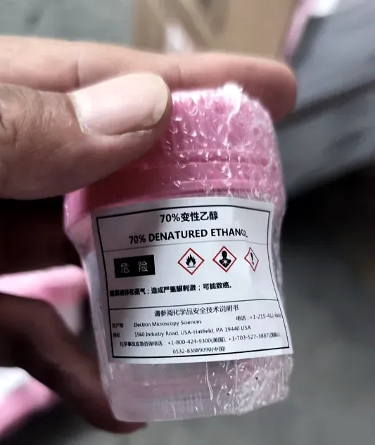 A bottle of 70 per cent denatured ethanol carrying a bilingual Chinese and English GHS hazard label