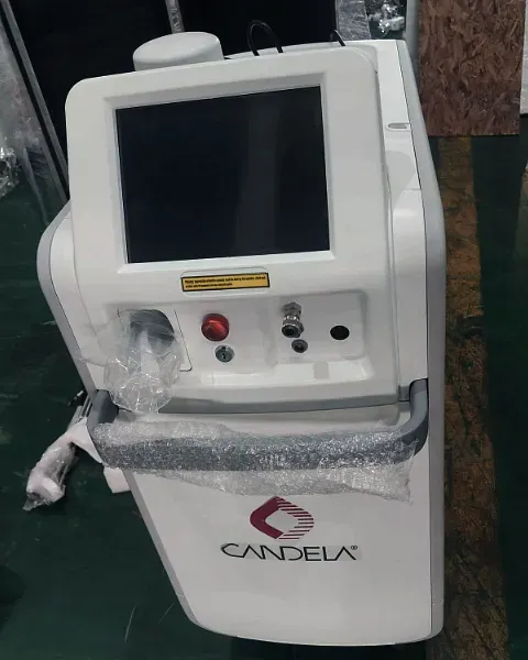 A laser treatment system on its castors, partly wrapped in bubble film